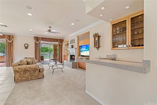 a view of a dining room with furniture and window