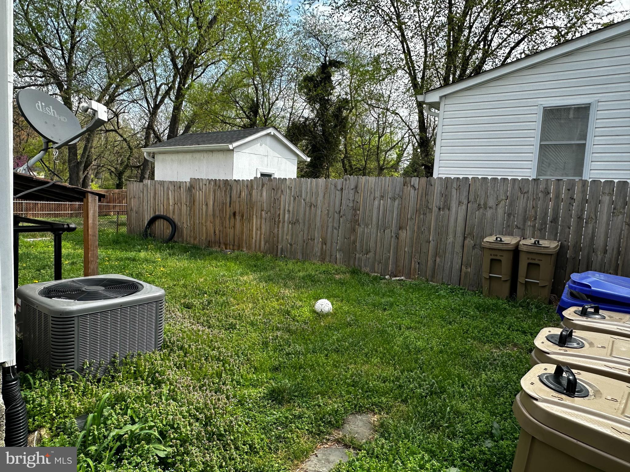 214 10th Street Laurel, MD 20707 - Photo 14 of 118 a backyard of a house with lots of green space