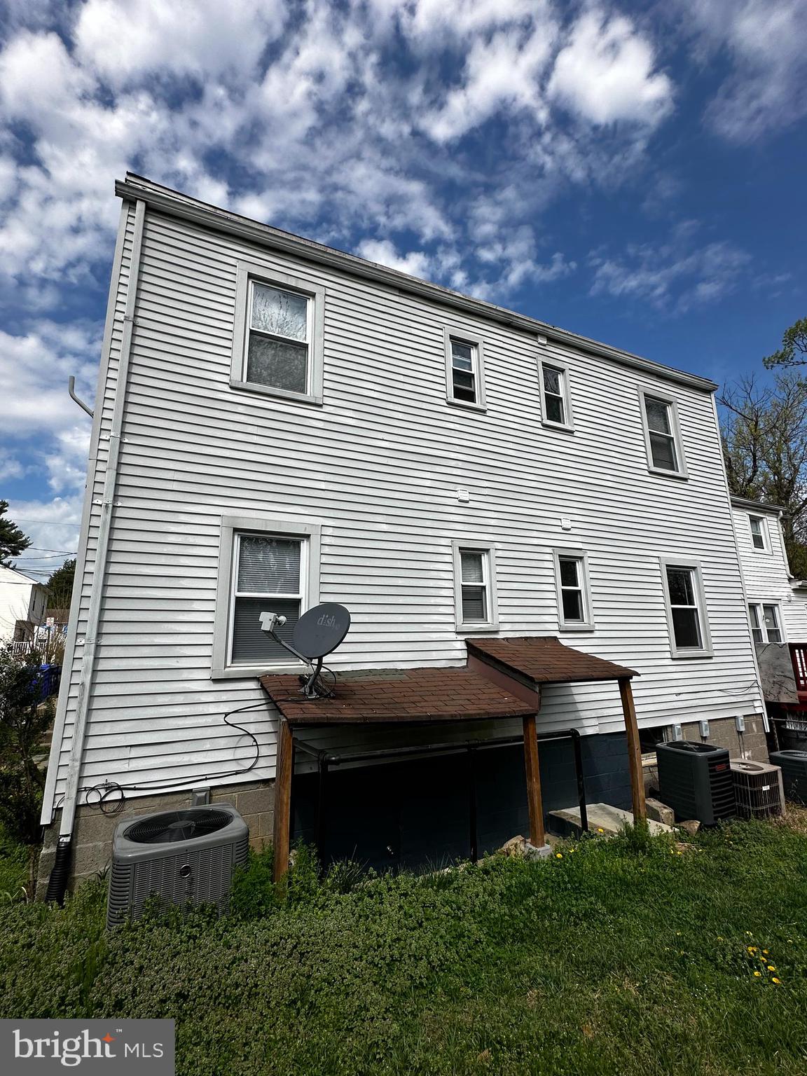 214 10th Street Laurel, MD 20707 - Photo 16 of 118 a backyard of a house with table and chairs