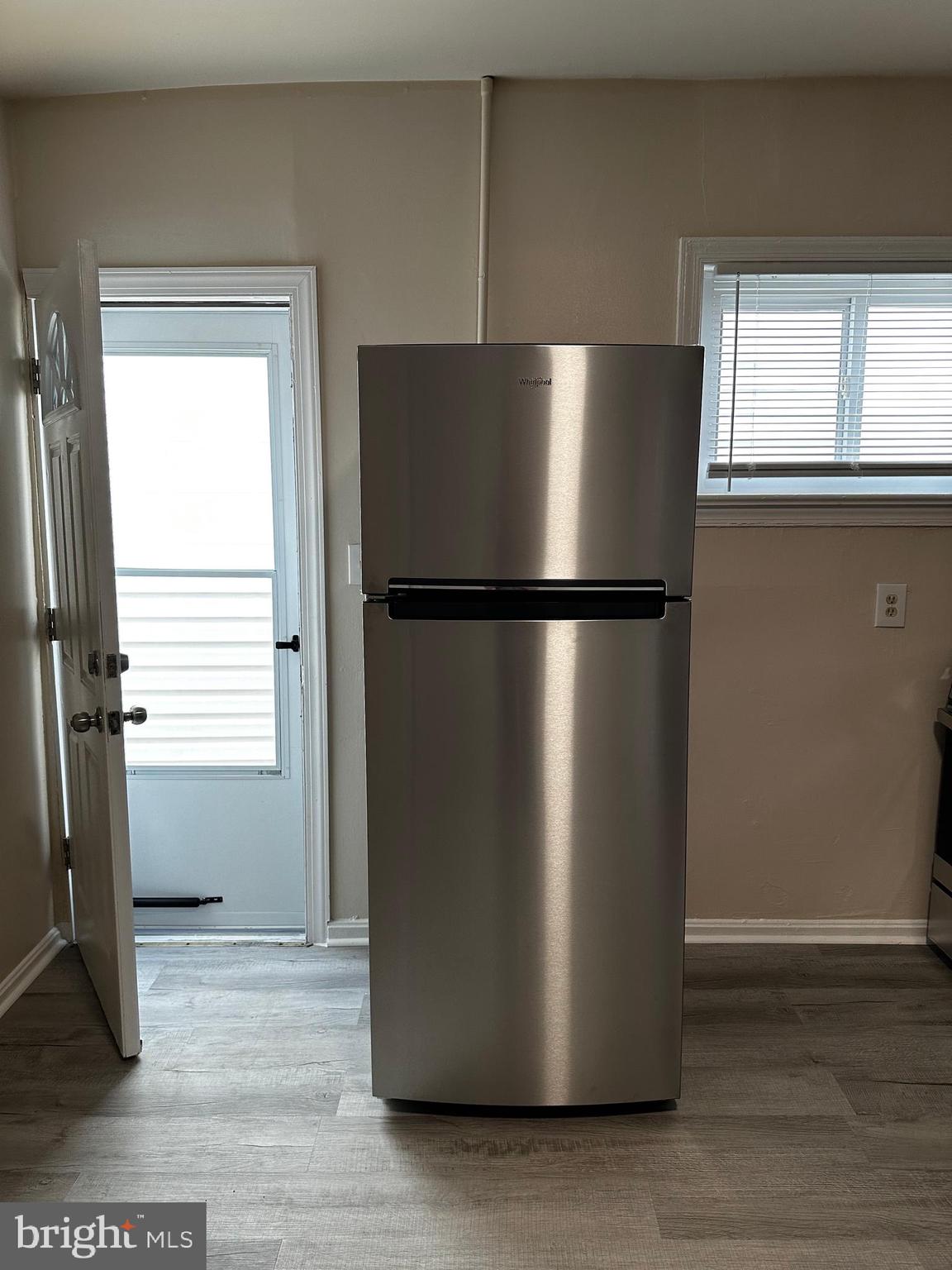 214 10th Street Laurel, MD 20707 - Photo 35 of 118 a white refrigerator freezer sitting in a kitchen