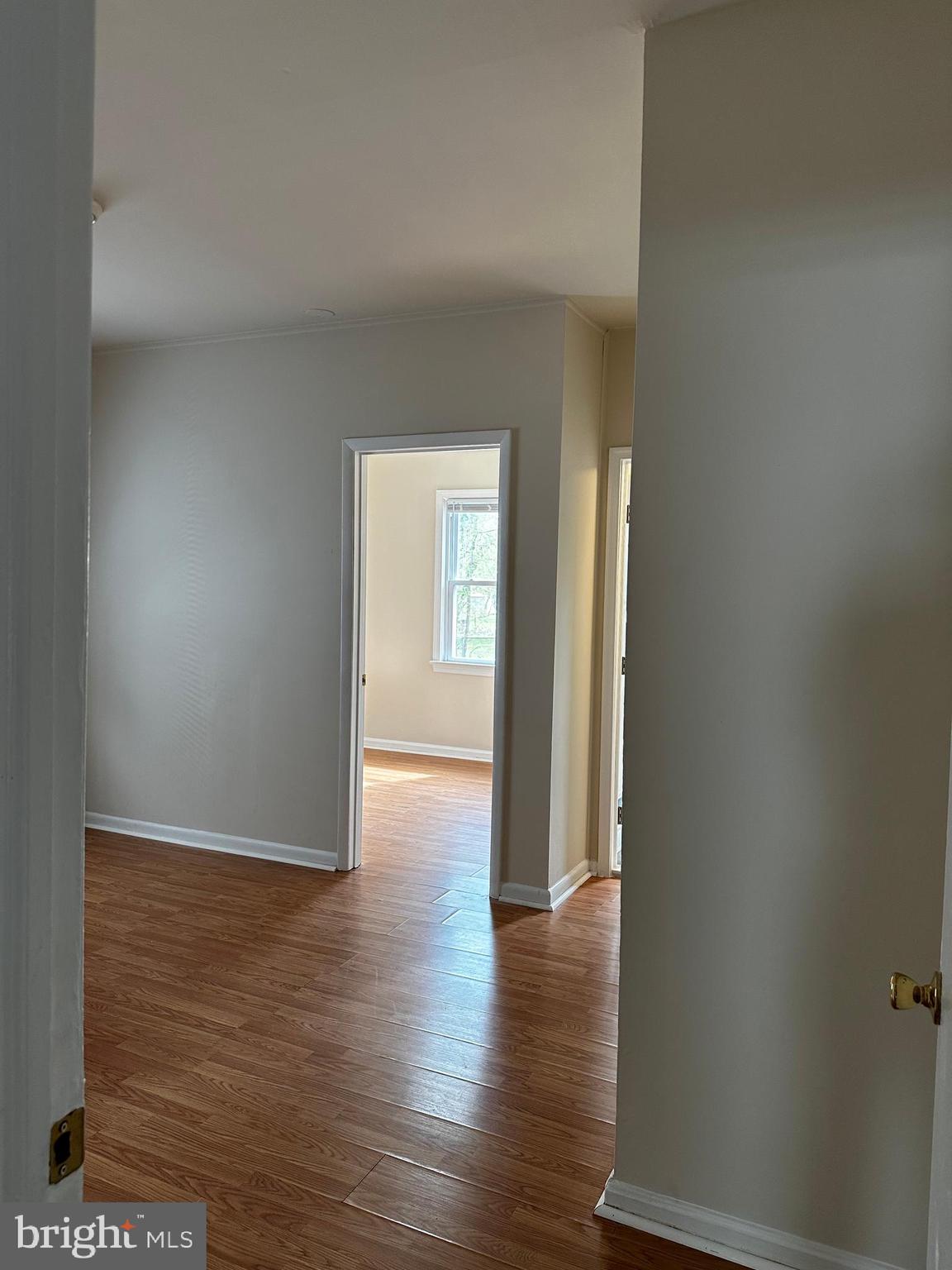 214 10th Street Laurel, MD 20707 - Photo 37 of 118 a view of an empty room with wooden floor and closet