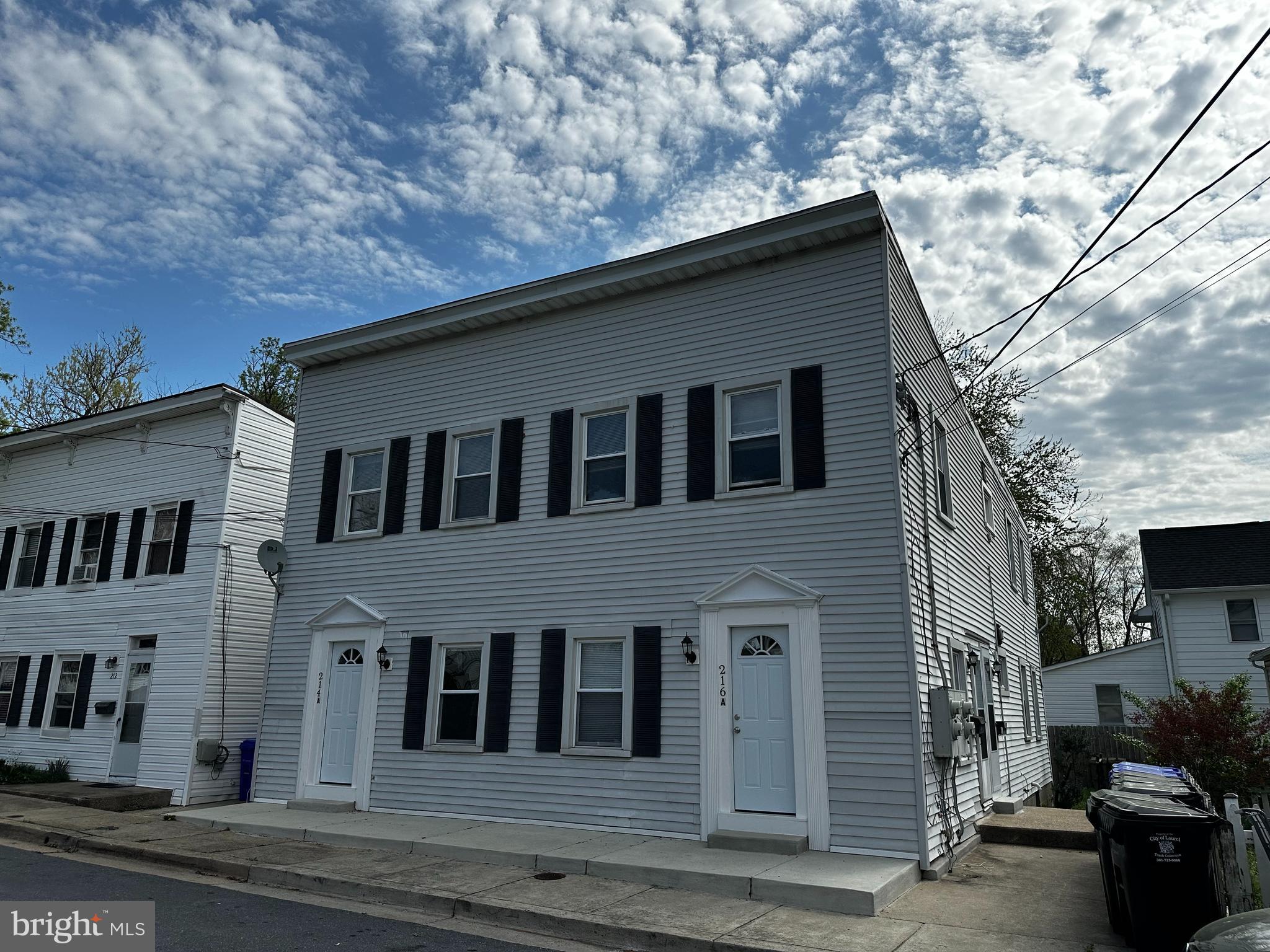 214 10th Street Laurel, MD 20707 - Photo 4 of 118 a house that has a tree in front of it