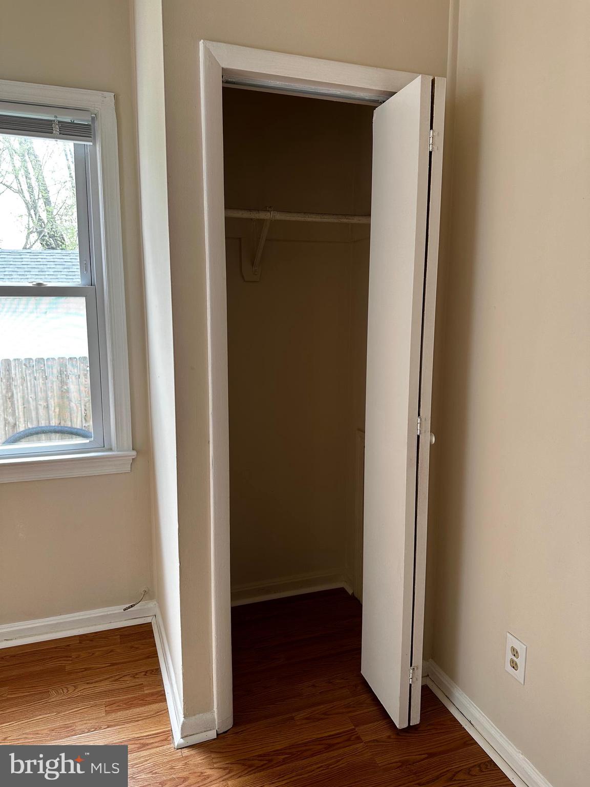 214 10th Street Laurel, MD 20707 - Photo 44 of 118 a view of an empty room with wooden floor and a window