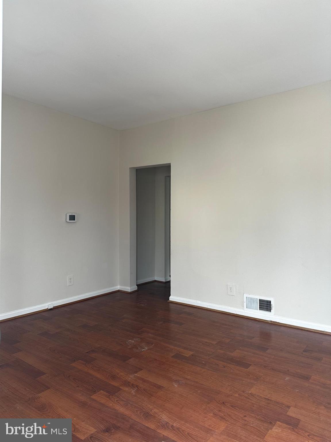 214 10th Street Laurel, MD 20707 - Photo 51 of 118 a view of an empty room with wooden floor
