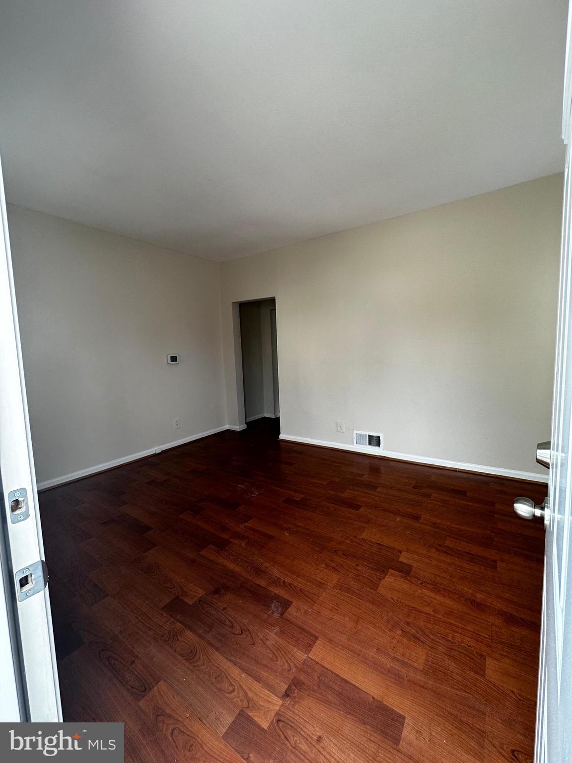214 10th Street Laurel, MD 20707 - Photo 52 of 118 a view of empty room with wooden floor
