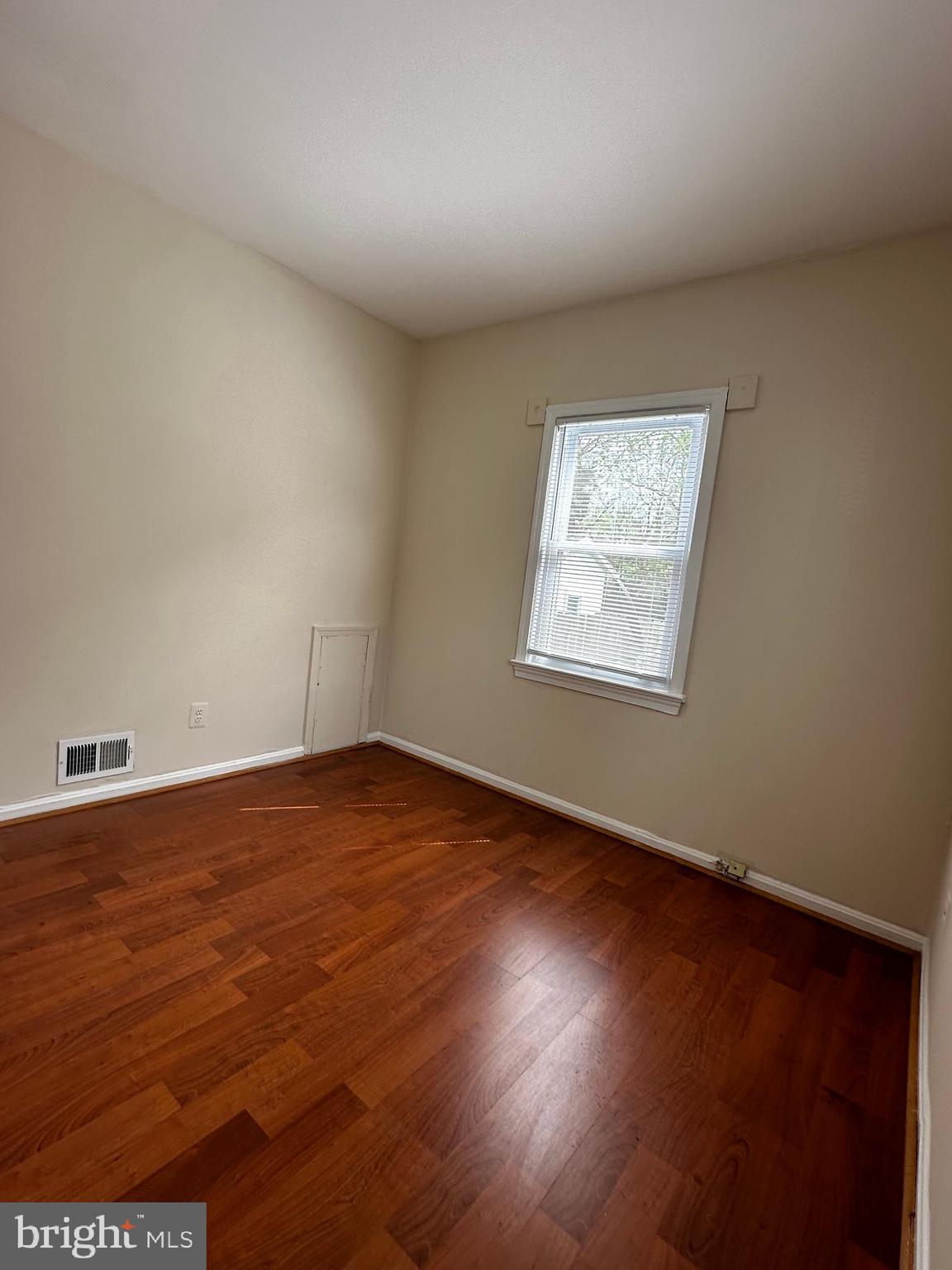 214 10th Street Laurel, MD 20707 - Photo 70 of 118 an empty room with wooden floor and windows