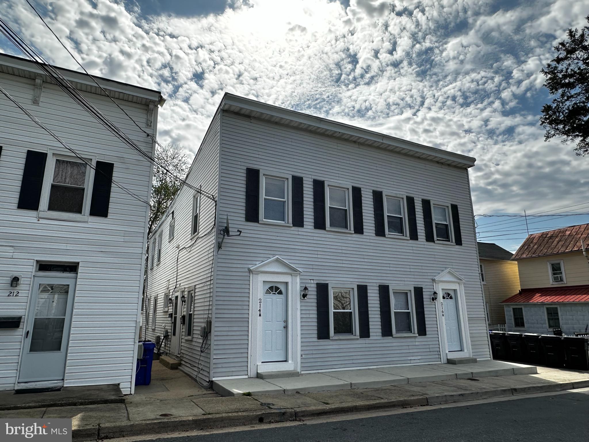 214 10th Street Laurel, MD 20707 - Photo 7 of 118 a front view of a house with a yard