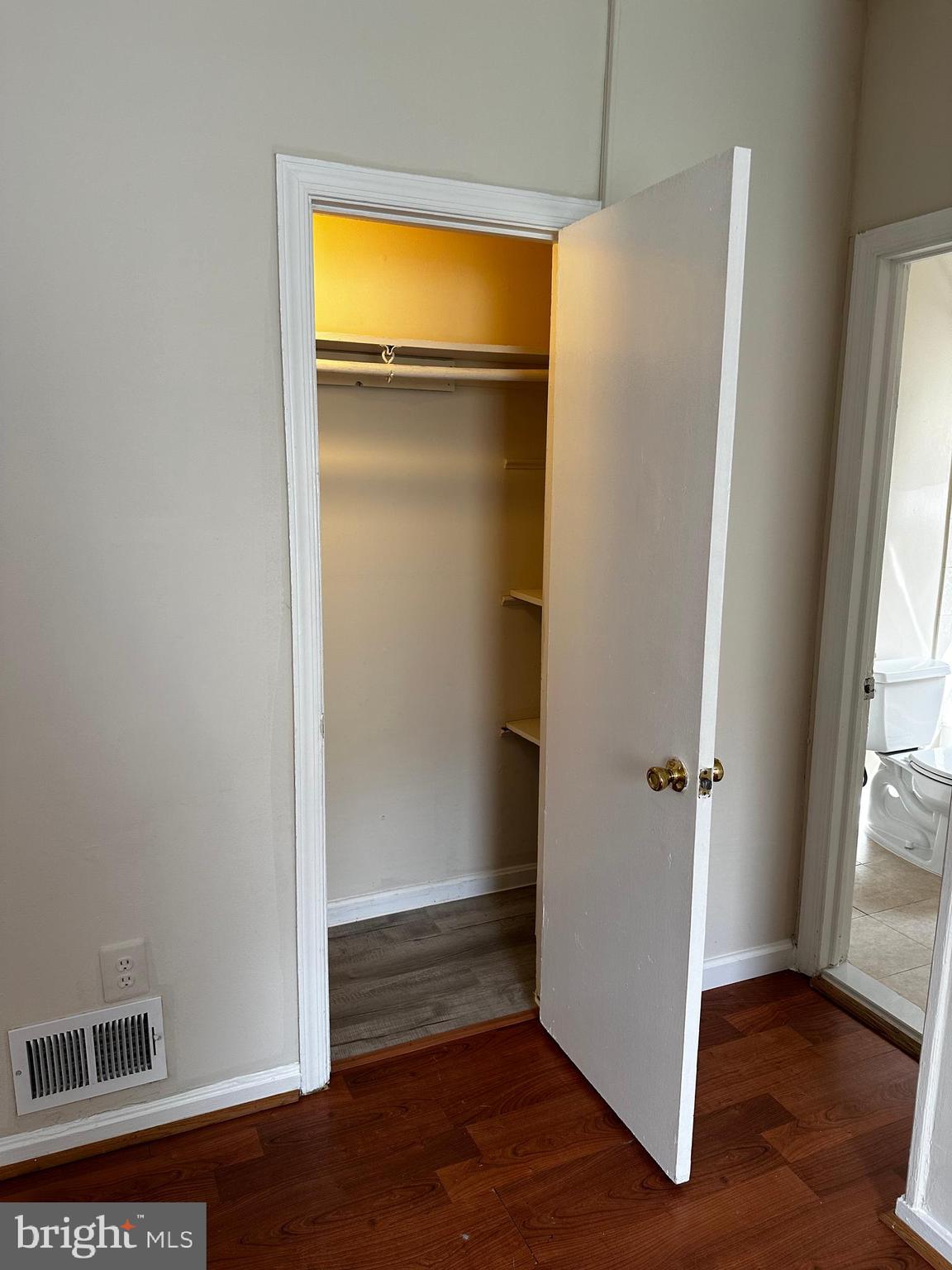 214 10th Street Laurel, MD 20707 - Photo 72 of 118 a view of an empty room with wooden floor and a window