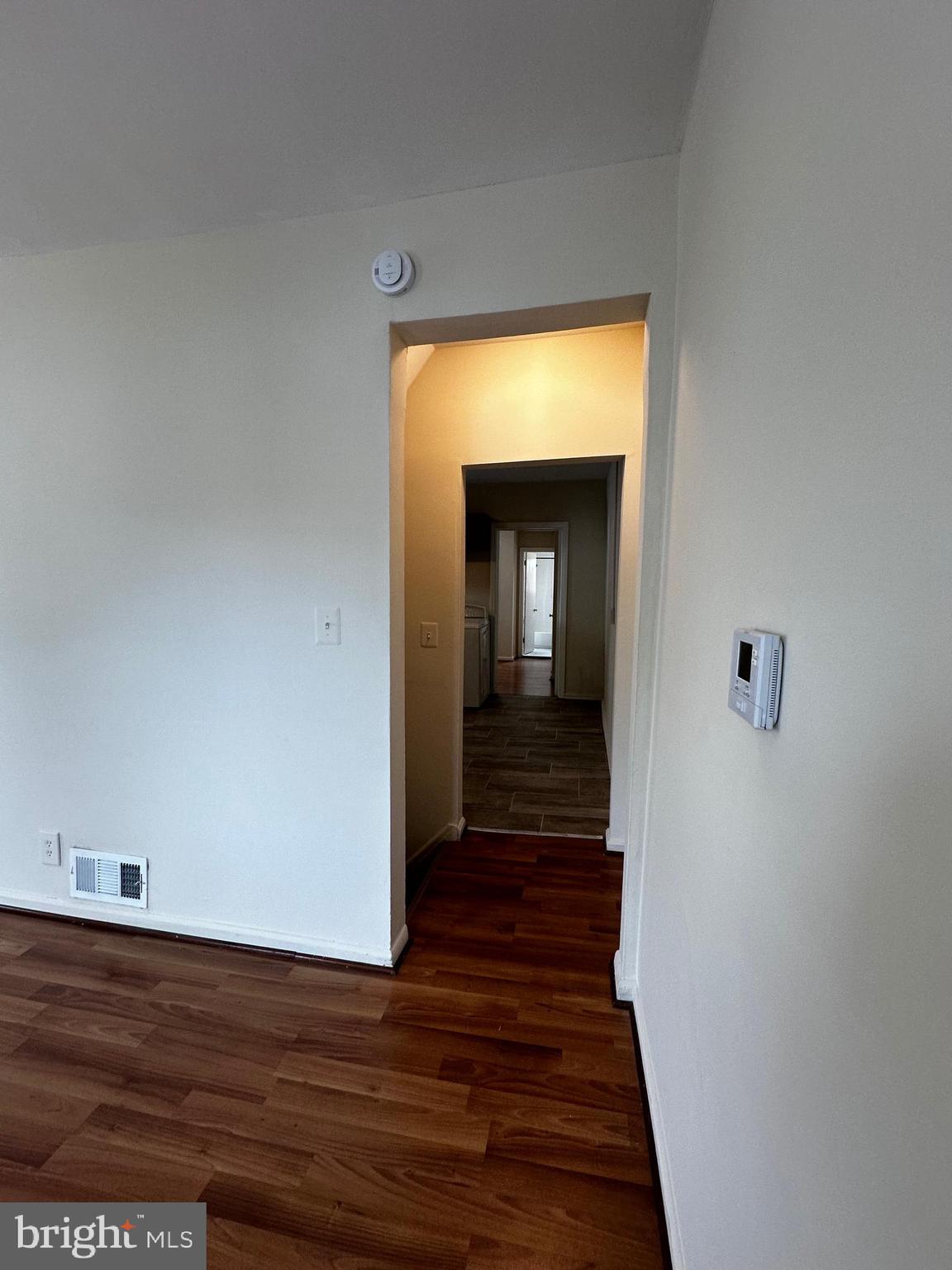 214 10th Street Laurel, MD 20707 - Photo 84 of 118 a view of a hallway with wooden floor and closet
