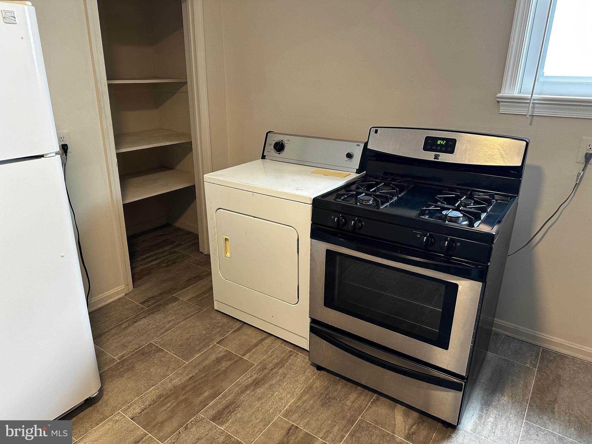 214 10th Street Laurel, MD 20707 - Photo 88 of 118 a stove top oven sitting inside of a kitchen