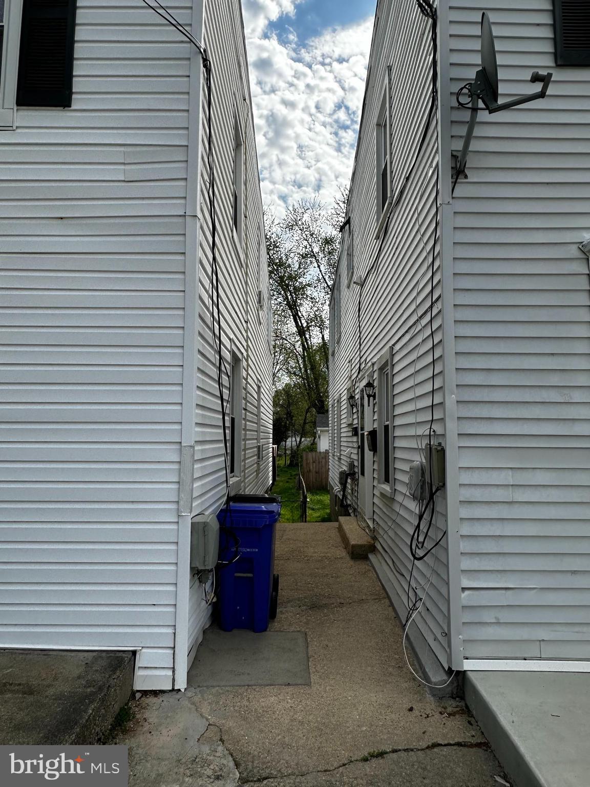 214 10th Street Laurel, MD 20707 - Photo 9 of 118 a view of a patio with a table and chairs and wooden fence