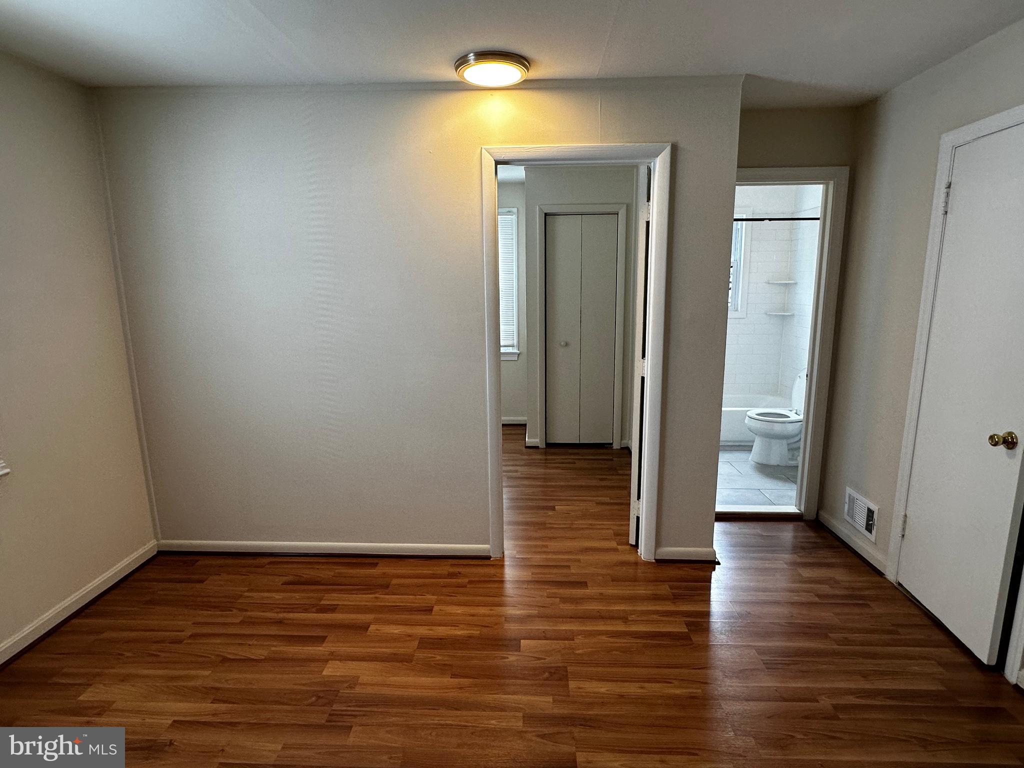 214 10th Street Laurel, MD 20707 - Photo 93 of 118 a view of a hallway with wooden floor