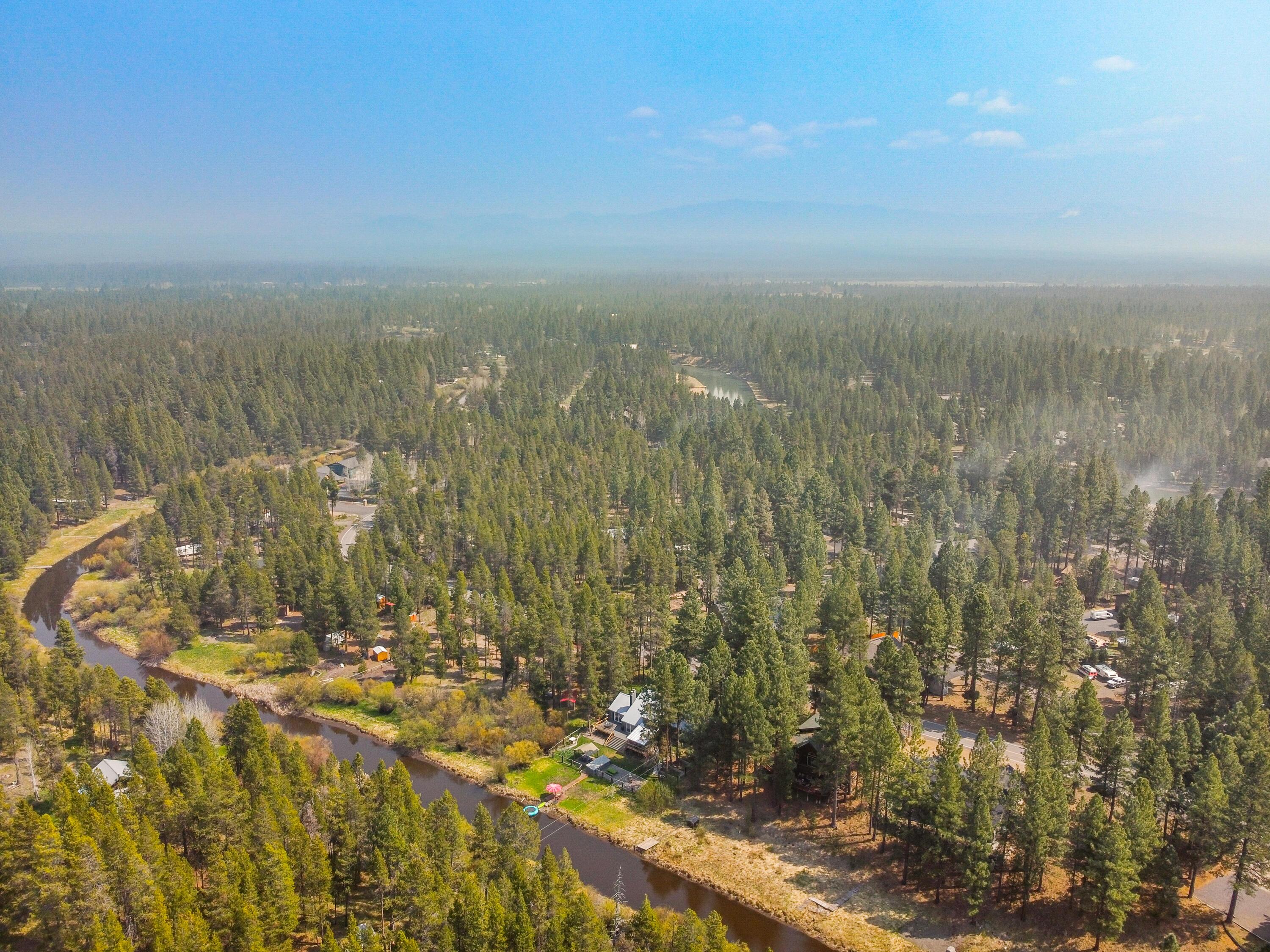17062 Milky Way Bend, OR 97707 - Photo 35 of 39 Aerial showing the chalet along the river bend within the Central Oregon forest