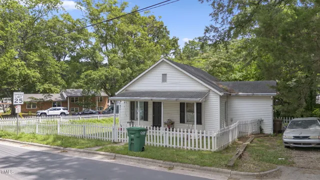 a view of a house with a yard from a patio