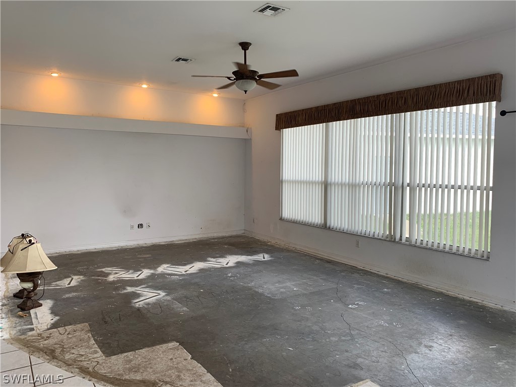212 Danby Road Lehigh Acres, FL 33936 - Photo 12 of 21 a view of an empty room and a window