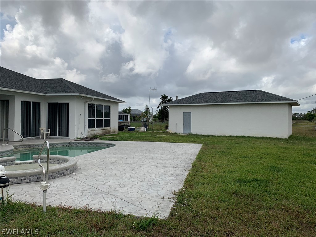 212 Danby Road Lehigh Acres, FL 33936 - Photo 16 of 21 a view of a yard in front of house