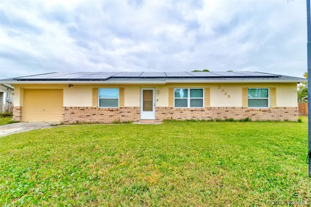 a front view of house with yard and seating space