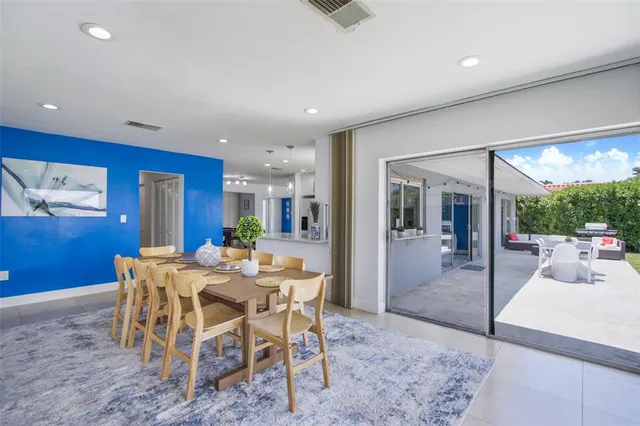 a view of a dining room with furniture window and outside view