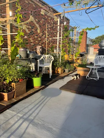 a view of a balcony with cars