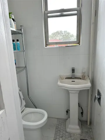 a bedroom with furniture and a wooden floor