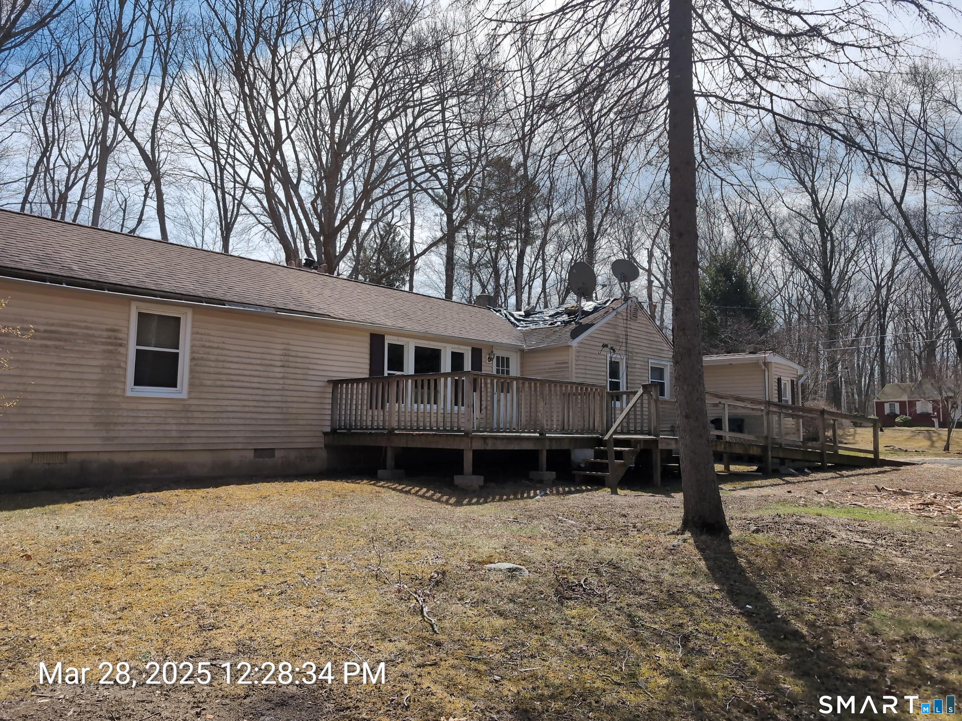 97 Bushy Hill Road Deep River, CT 06417 - Photo 7 of 28 a front view of a house with a yard covered in snow