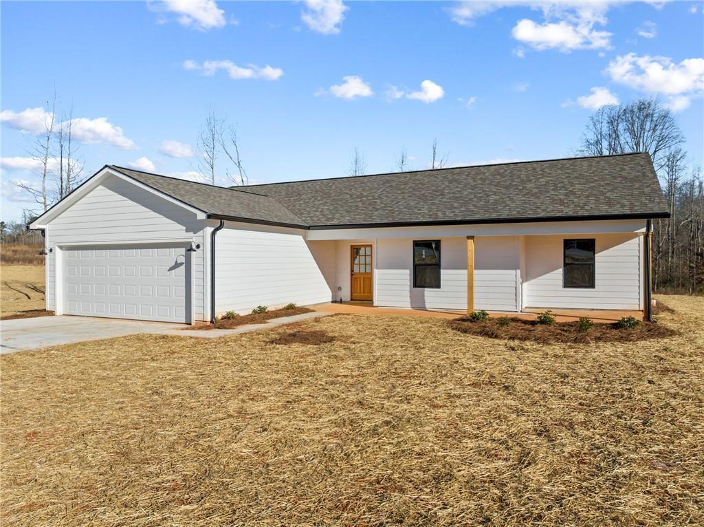7342 Lula Road Lula, GA 30554 - Photo 1 of 1 a front view of a house with a garage