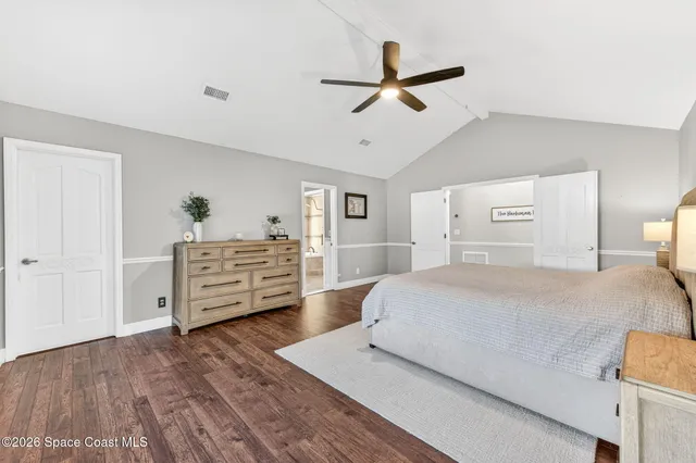 a view of a livingroom with furniture and a flat screen tv