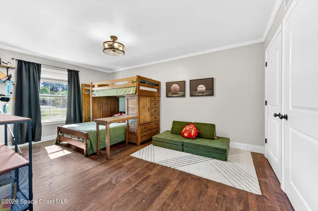 a bathroom with a toilet sink double vanity and mirror