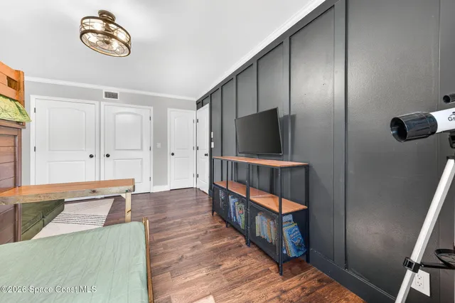 a view of a house with wooden deck