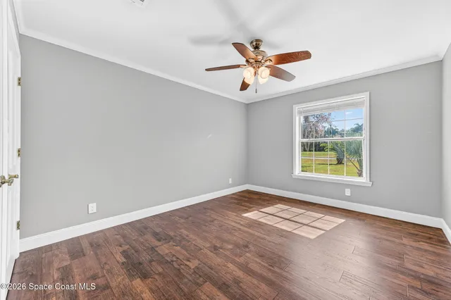 a view of a patio with table and chairs