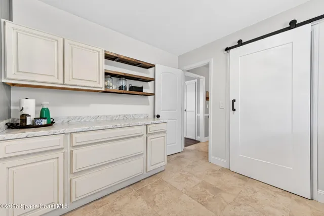 a view of yard with swimming pool and green space