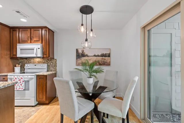 a dining room with furniture and window