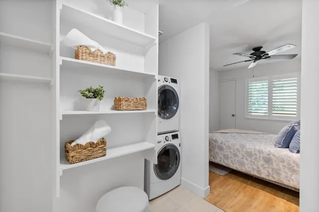 a en suite bathroom with a granite countertop sink and a mirror