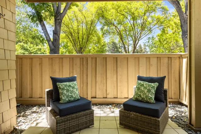 a outdoor living space with furniture and a potted plant