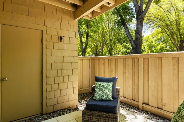 a view of chair and glass door