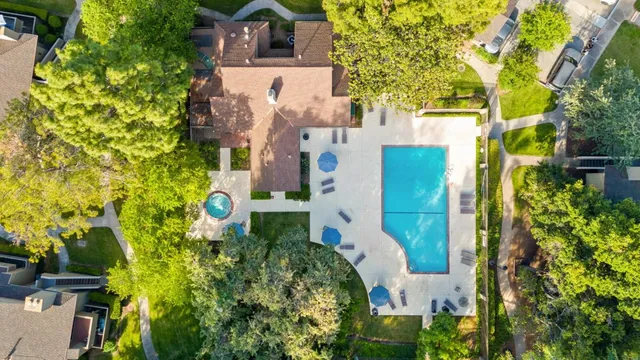 an aerial view of residential houses with outdoor space