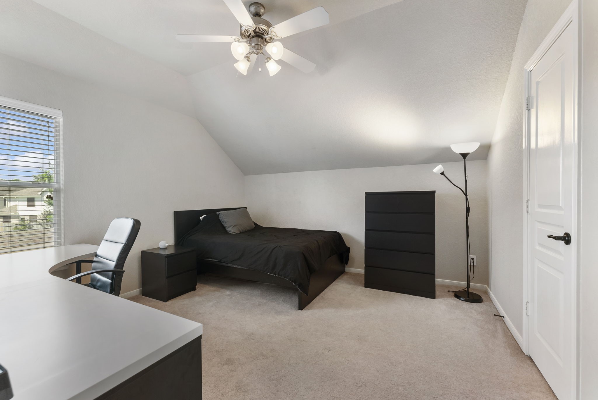 19223 Senterra Lakes Boulevard Spring, TX 77379 - Photo 32 of 48 a bedroom with a bed and dresser