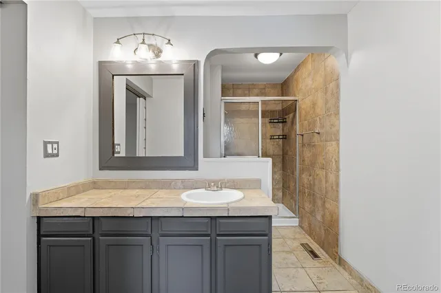 a bathroom with a sink and a mirror
