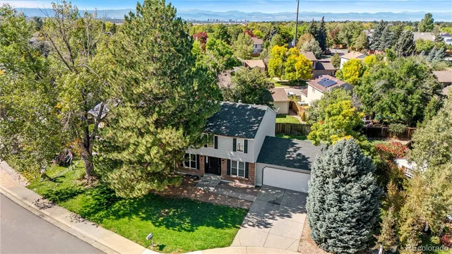 an aerial view of a house with garden space and sitting space