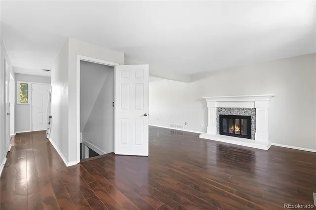 a kitchen with a refrigerator sink and cabinets