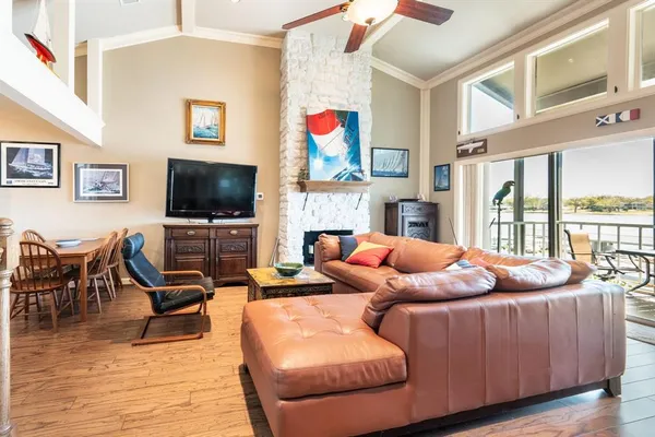 a living room with furniture fireplace and a flat screen tv