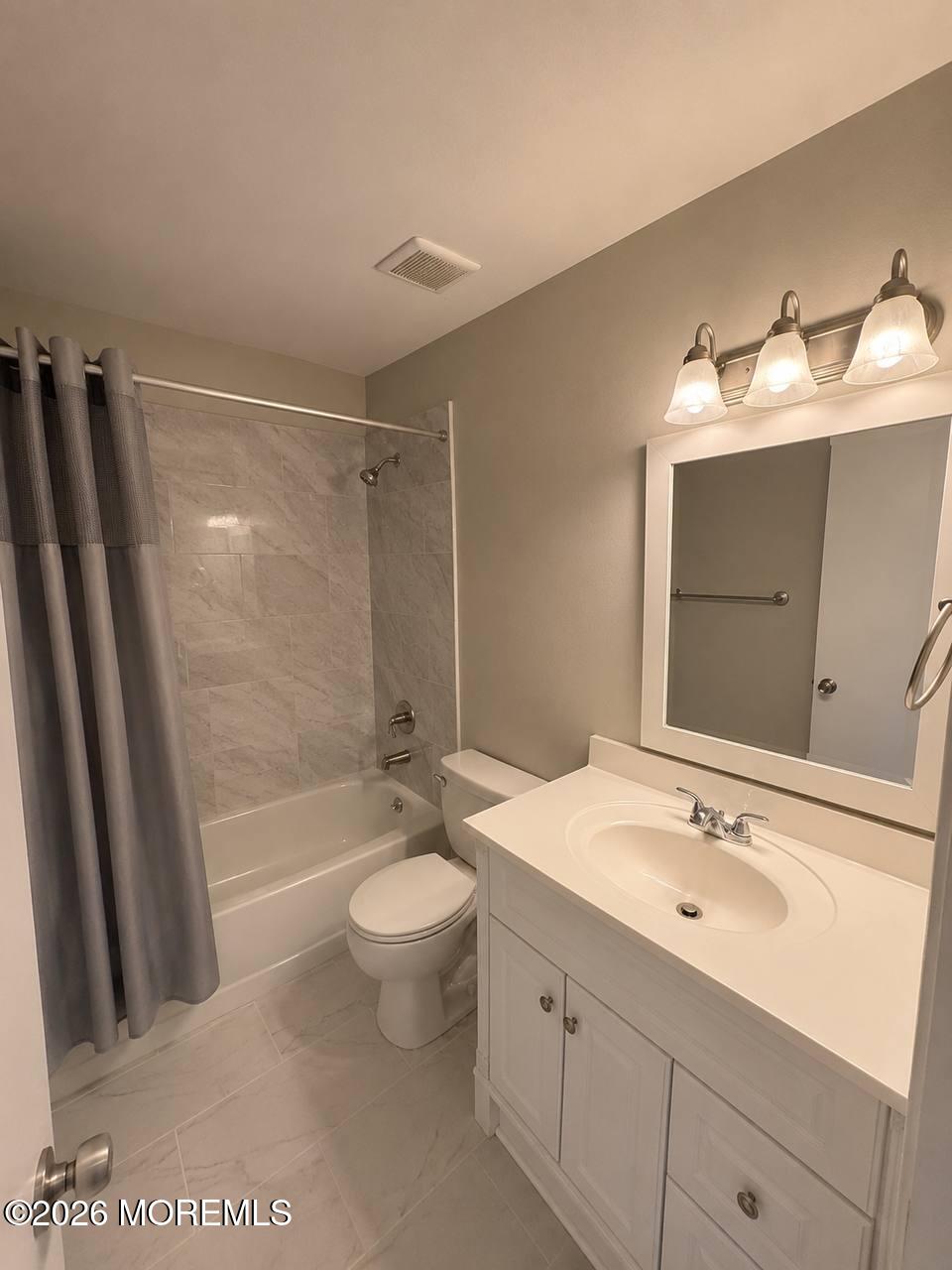 1144 Sawmill Road, Unit 121 Brick, NJ 08724 - Photo 16 of 23 a bathroom with a sink toilet a mirror and shower