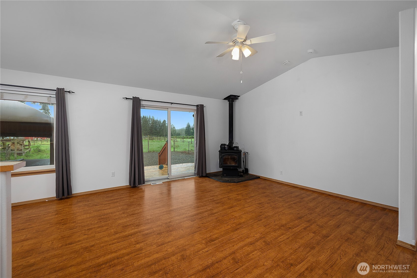 7606 187th Avenue Southwest Rochester, WA 98579 - Photo 9 of 28 a view of an empty room with a window
