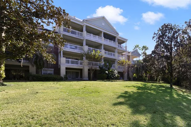a view of a building with a yard