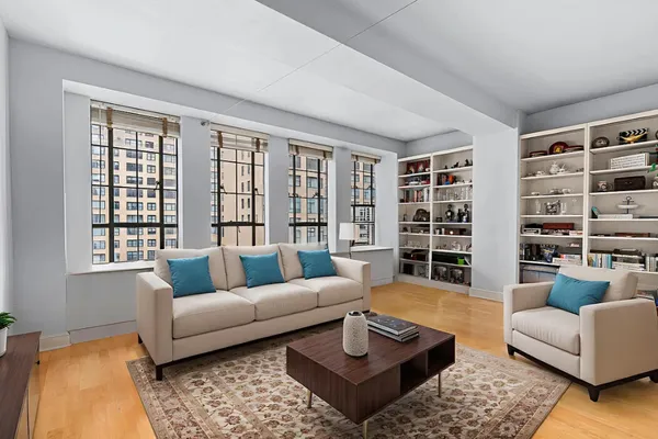 a living room with furniture and a large window