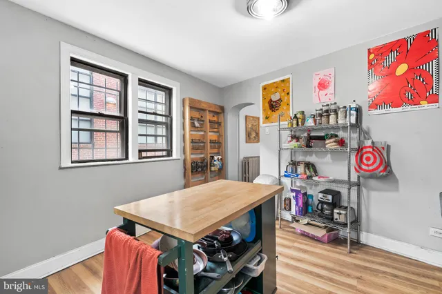 a view of a dining room with furniture and a window