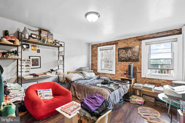 a bedroom with bed and a window