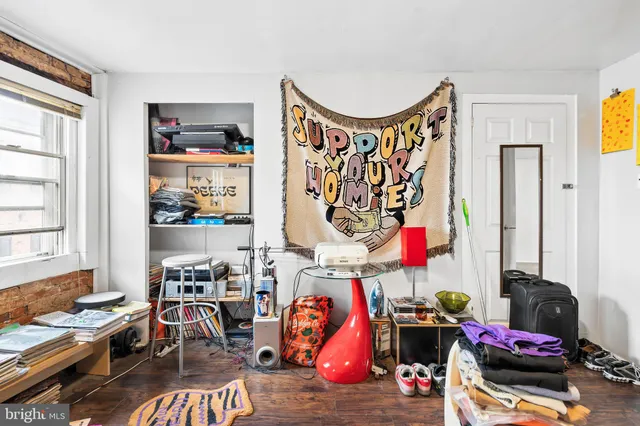 a living room with lots of furniture and a window