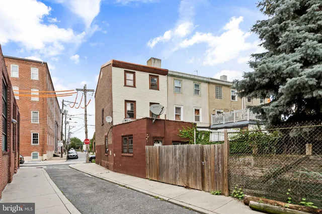 a front view of a house with large windows
