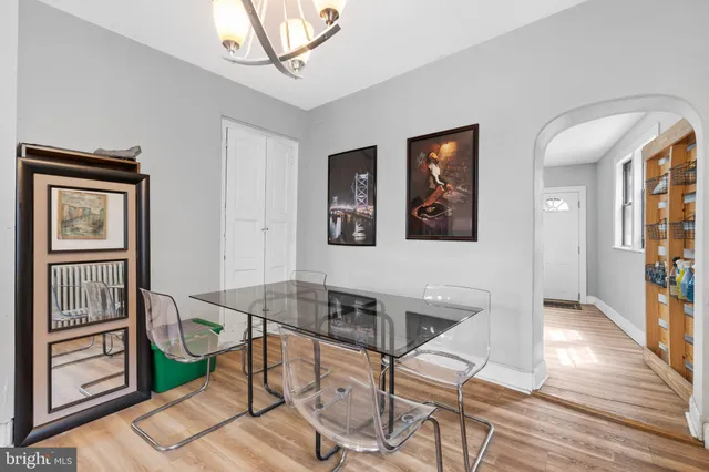 a view of a livingroom with furniture and hardwood floor